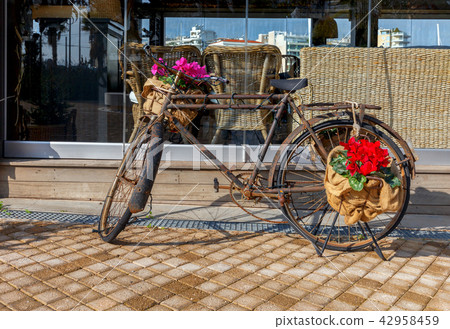 Old bicycle with flowers. Old bicycle with flowers. 42958459