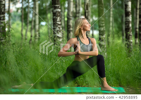 Young girl doing yoga in a birch-tree grove shot Young girl doing yoga in a birch-tree grove shot 42958895