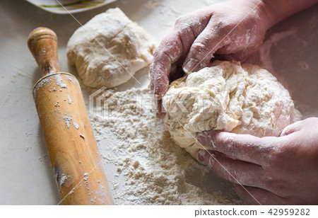 Preparation of flour dough with female hands Preparation of flour dough with female hands 42959282
