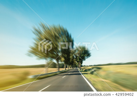 driving fast road in rural landscape motion blur driving fast road in rural landscape motion blur 42959402