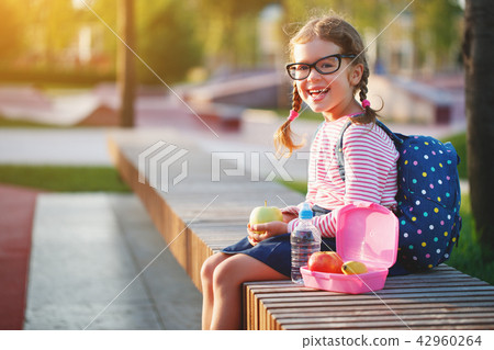 schoolgirl child eating lunch apples   at school 42960264