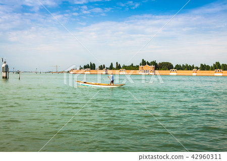 The man on the boat Venice, Italy 42960311