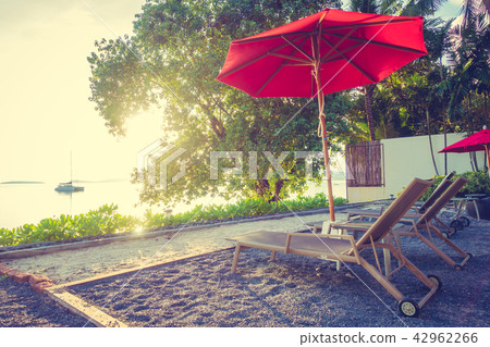 Beautiful tropical sea ocean and beach with umbrella and chair Beautiful tropical sea ocean and beach with umbrella and chair 42962266