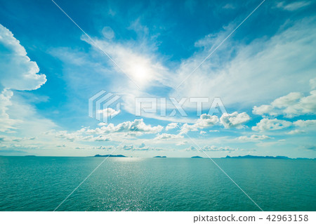 Beautiful white cloud on blue sky and sea or ocean Beautiful white cloud on blue sky and sea or ocean 42963158