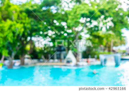 Abstract blur and defocused beautiful outdoor swimming pool in hotel and resort Abstract blur and defocused beautiful outdoor swimming pool in hotel and resort 42963166