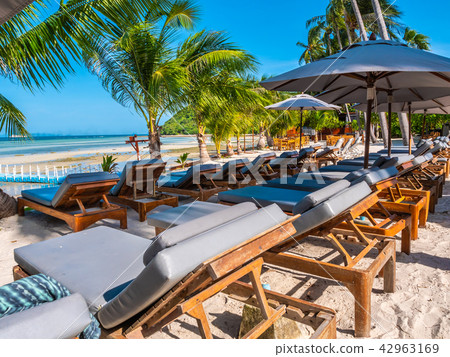 Umbrella and chair on the beach and sea ocean with blue sky 42963169
