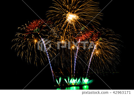Beautiful fireworks display on black sky Beautiful fireworks display on black sky 42963171