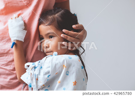 Sick asian little child girl hugging her mother 42965780