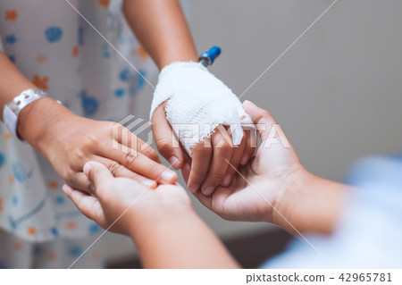 Child girl holding sick young sister hand 42965781