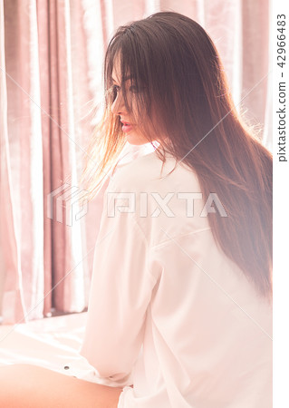 Portrait of beautiful Asian woman sit on the bed. Portrait of beautiful Asian woman sit on the bed. 42966483