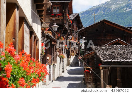 Flower village Alley of Grimens (valley of Annievie, Switzerland) Flower village Alley of Grimens (valley of Annievie, Switzerland) 42967032