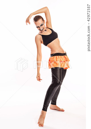 Girl with clown makeup dances 42971587