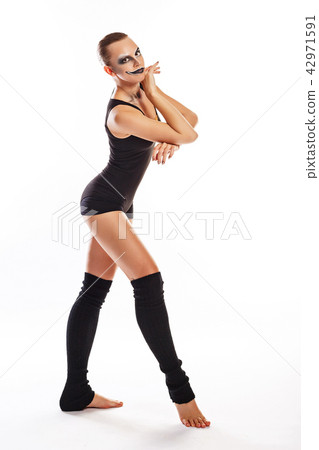Girl with clown makeup dances 42971591