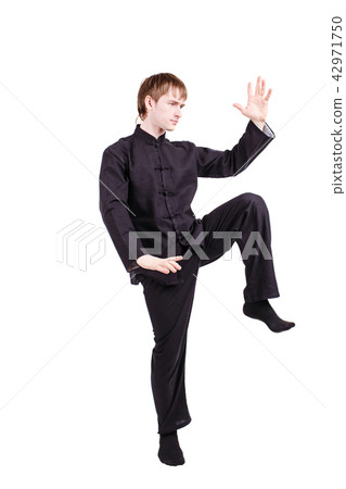 Man in a kimono practicing kung fu 42971750