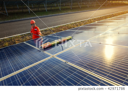 Engineers are checking the solar panel maintenance Engineers are checking the solar panel maintenance 42971786