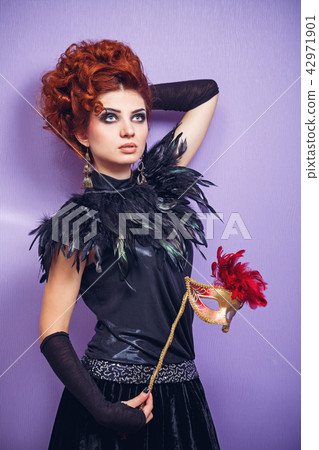 Red-haired lady in mask Red-haired lady in mask 42971901