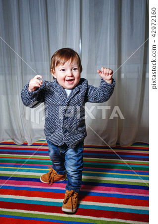 Little boy wearing a jacket 42972160