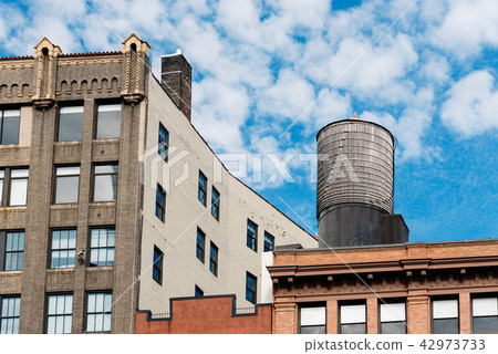 Cityscape of New York with old buildings and water tower 42973733