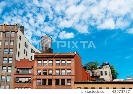 Cityscape of New York with old buildings and water tower Cityscape of New York with old buildings and water tower 42973737