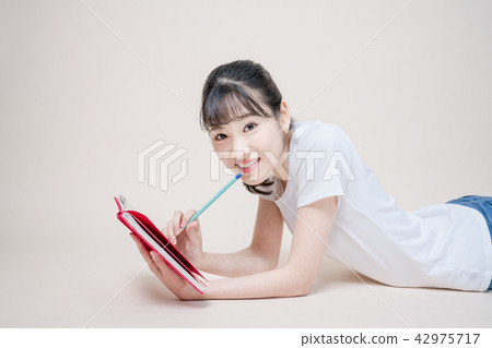A woman in jeans and posing in various poses A woman in jeans and posing in various poses 42975717