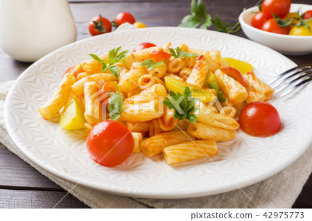 Macaroni, pasta in tomato sauce and cheese  42975773