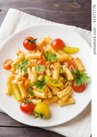 Macaroni, pasta in tomato sauce and cheese  42975776