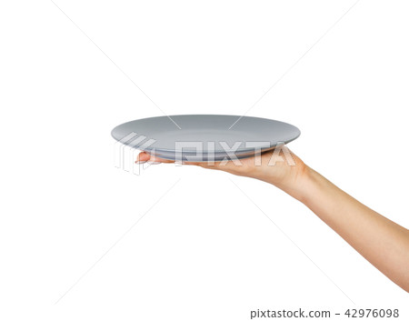 Hand holding empty plate isolated Hand holding empty plate isolated 42976098