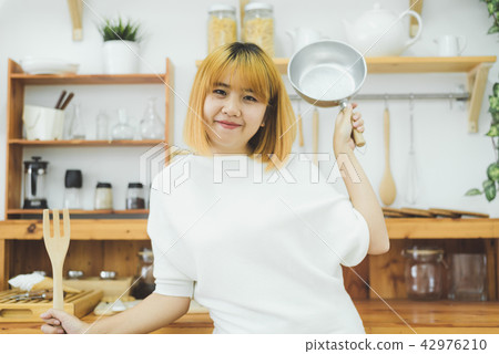 woman making healthy food in kitchen.  42976210