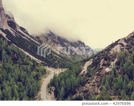 Aerial drone view over road in high mountains Aerial drone view over road in high mountains 42976896