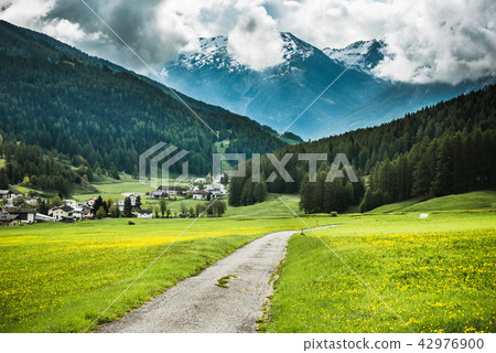 Rural road ito mountain village in Switzerland Rural road ito mountain village in Switzerland 42976900