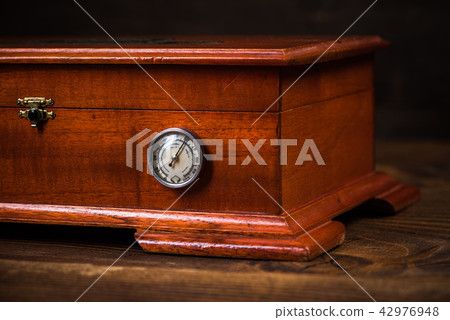 Wooden humidor for storage cigars 42976948