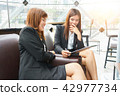 Smiled business woman talking their work 42977734