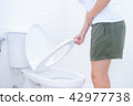 A woman open toilet with diarrhea pain concept 42977738