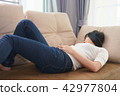 Woman touching her own belly with stomachache 42977804