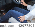 woman leg with pain - long driving on the way 42977805