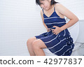 Woman sitting on toilet with diarrhea or pain 42977837