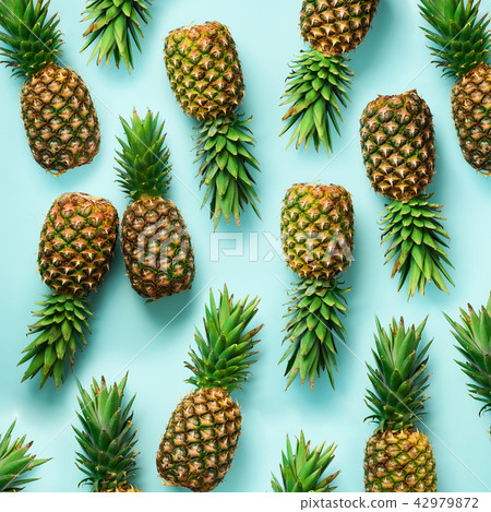 Square crop. Fresh pineapples on blue background 42979872