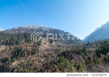 Mountains against the blue sky Mountains against the blue sky 42979879
