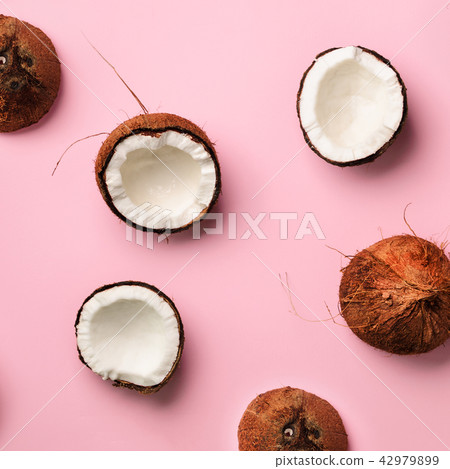 Pattern with ripe coconuts on pink background. Top Pattern with ripe coconuts on pink background. Top 42979899