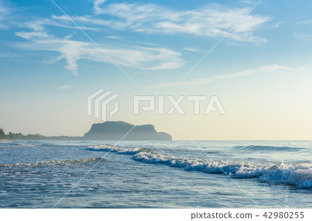 Rocks mountain in the middle of the sea 42980255