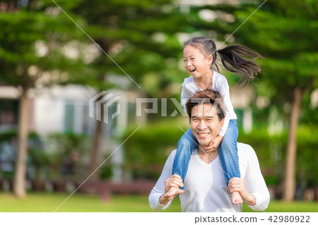 Cute Asian girl on neck dad big happy laughing. Cute Asian girl on neck dad big happy laughing. 42980922