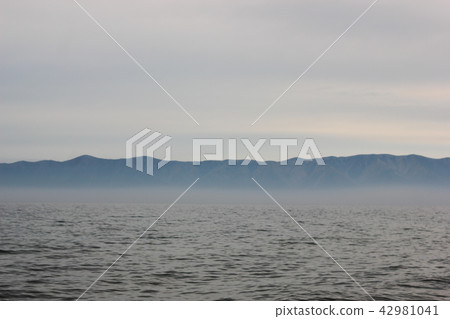 Atmospheric marine landscape with wavy water Atmospheric marine landscape with wavy water 42981041