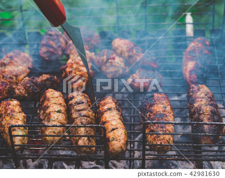 Barbecue grilling shish kebab. Clos up view. Grill, Frying Fresh Meat, Chicken Barbecue, Sausage 42981630
