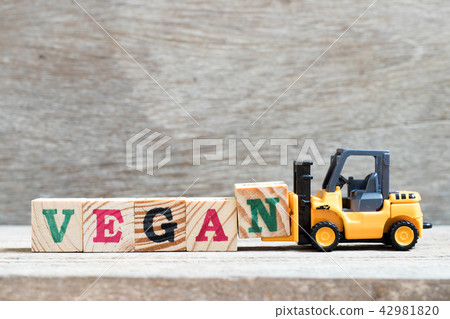 Toy forklift hold letter block n to word vegan Toy forklift hold letter block n to word vegan 42981820
