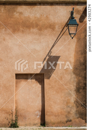 Lantern on the wall and its shadow Lantern on the wall and its shadow 42983274