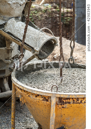 Pouring concrete into the construction of the house Pouring concrete into the construction of the house 42983943