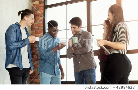 Coffee break chat at office Coffee break chat at office 42984628