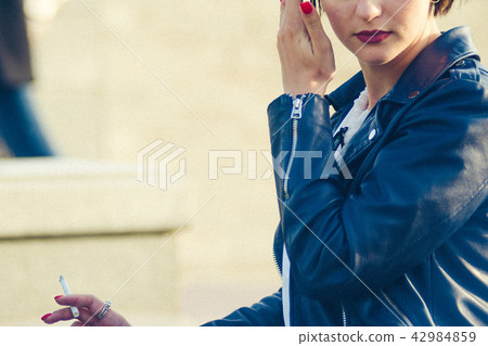 Smoking girl on the street Smoking girl on the street 42984859