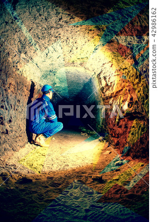 Man worker check something in abandoned tunnel. 42986162