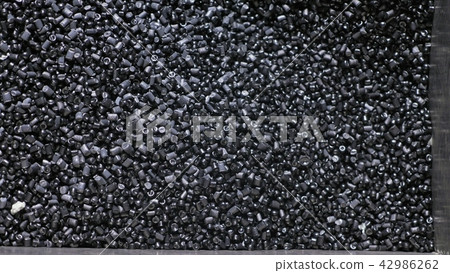 Plastic black gray granulated crumb. Manufacture of plastic water pipes factory. Process of making Plastic black gray granulated crumb. Manufacture of plastic water pipes factory. Process of making 42986262